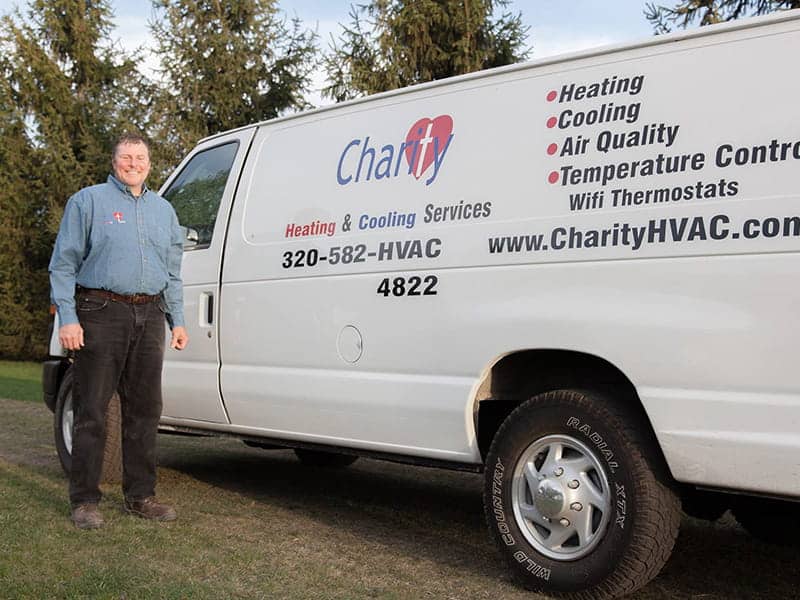 brian with charity heating and cooling branded van