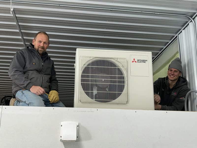 team installing mitsubishi electric ac unit